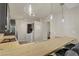Kitchen with wooden counter tops, stainless steel appliances, breakfast bar, and modern lighting at 725 N Royal Crest Cir # 214, Las Vegas, NV 89169