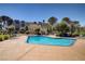 Inviting community pool and lounging area, surrounded by greenery and landscaping at 725 N Royal Crest Cir # 214, Las Vegas, NV 89169