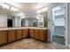 Bathroom with double vanities and a view into the walk-in closet at 7416 Redhead Dr, North Las Vegas, NV 89084