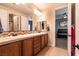Dual sink bathroom with separate shower and toilet rooms for added convenience at 7416 Redhead Dr, North Las Vegas, NV 89084