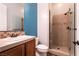 Bathroom featuring a single sink vanity, tile shower and coordinated tile accents at 7416 Redhead Dr, North Las Vegas, NV 89084