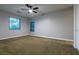 Bedroom featuring plush carpet, a ceiling fan, and natural light at 7416 Redhead Dr, North Las Vegas, NV 89084