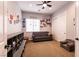 This bedroom offers ample natural light, a ceiling fan, and a roomy closet for storage at 7416 Redhead Dr, North Las Vegas, NV 89084