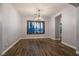 Formal dining room featuring a decorative chandelier and hardwood floors at 7416 Redhead Dr, North Las Vegas, NV 89084