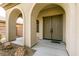 Grand entrance with a double door and elegant archways, creating a welcoming first impression at 7416 Redhead Dr, North Las Vegas, NV 89084