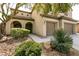 Elegant two-story home with a three-car garage and meticulously maintained landscaping at 7416 Redhead Dr, North Las Vegas, NV 89084