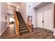 Elegant foyer with staircase, tile floors, and double doors, providing a grand entry at 7416 Redhead Dr, North Las Vegas, NV 89084