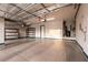 Spacious garage with epoxy floors, storage shelves, and a clean, organized layout at 7416 Redhead Dr, North Las Vegas, NV 89084