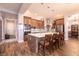 Modern kitchen with stainless steel appliances, large island, and stylish pendant lighting at 7416 Redhead Dr, North Las Vegas, NV 89084