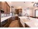 Gourmet kitchen with custom cabinets, a farmhouse sink and stainless steel appliances at 7416 Redhead Dr, North Las Vegas, NV 89084