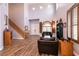 Inviting living room features high ceilings, lots of natural light, and wood-look tile flooring at 7416 Redhead Dr, North Las Vegas, NV 89084