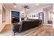 Comfortable living room with modern ceiling fan, fireplace, recessed lighting, and wood-look tile at 7416 Redhead Dr, North Las Vegas, NV 89084
