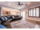 Open concept living room with wood-look tile floors, recessed lights, and sliding glass doors to the backyard at 7416 Redhead Dr, North Las Vegas, NV 89084