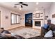 Cozy living room features a fireplace and accent wall, providing a perfect place to unwind at 7416 Redhead Dr, North Las Vegas, NV 89084