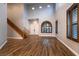 Bright and airy living room with soaring ceilings, wood-look floors, and oversized windows at 7416 Redhead Dr, North Las Vegas, NV 89084