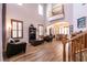 Spacious living room with high ceilings, wood floors, and abundant natural light at 7416 Redhead Dr, North Las Vegas, NV 89084