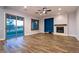 Spacious living room with fireplace, ceiling fan, and sliding glass doors to backyard at 7416 Redhead Dr, North Las Vegas, NV 89084