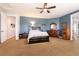Large main bedroom with ceiling fan, ensuite bathroom, and plentiful closet space at 7416 Redhead Dr, North Las Vegas, NV 89084