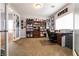 Comfortable home office featuring built-in shelves, desk space, and natural light at 7416 Redhead Dr, North Las Vegas, NV 89084