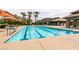 Community pool features a lap lane swimming pool with shaded seating and palm trees at 7416 Redhead Dr, North Las Vegas, NV 89084