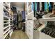 Custom designed walk-in closet with built-in shelves and cabinets for optimal storage at 7416 Redhead Dr, North Las Vegas, NV 89084