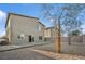 Backyard showcasing a gravel area, mature trees, and a paved patio, ideal for outdoor gatherings at 9068 Lennon Ln, Las Vegas, NV 89113