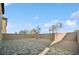 Backyard featuring a gravel area, mature trees, and a paved patio perfect for outdoor relaxation at 9068 Lennon Ln, Las Vegas, NV 89113