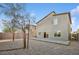 Wide backyard with desert landscaping and patio, surrounded by other homes at 9068 Lennon Ln, Las Vegas, NV 89113