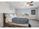 Spacious bedroom featuring neutral colors, a ceiling fan, and a comfortable bed at 9068 Lennon Ln, Las Vegas, NV 89113