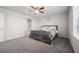 Bright bedroom with a wooden bed frame and an ensuite bathroom at 9068 Lennon Ln, Las Vegas, NV 89113
