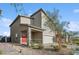 Beautiful home exterior featuring a two-car garage, covered porch, and desert landscaping at 9068 Lennon Ln, Las Vegas, NV 89113