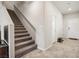 Bright interior staircase featuring tile floors and neutral walls at 9068 Lennon Ln, Las Vegas, NV 89113