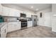 Well-equipped kitchen features white cabinets, granite counters, and stainless steel appliances at 9068 Lennon Ln, Las Vegas, NV 89113