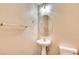 Cozy bathroom featuring a pedestal sink and neutral decor at 9115 Canoga Canyon Ct # 102, Las Vegas, NV 89149