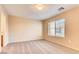 Inviting bedroom featuring neutral walls, carpet, and a window that provides natural light at 9115 Canoga Canyon Ct # 102, Las Vegas, NV 89149