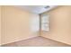 Neutral bedroom with carpet, bright window, and air vent on the ceiling at 9115 Canoga Canyon Ct # 102, Las Vegas, NV 89149