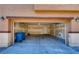 Two car garage with overhead lighting and door to the house at 9115 Canoga Canyon Ct # 102, Las Vegas, NV 89149