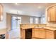 Kitchen view into the adjacent dining and living areas at 9115 Canoga Canyon Ct # 102, Las Vegas, NV 89149