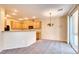 Well-lit kitchen with modern appliances and view into the dining space at 9115 Canoga Canyon Ct # 102, Las Vegas, NV 89149