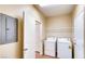 A laundry room featuring a full size washer and dryer at 9115 Canoga Canyon Ct # 102, Las Vegas, NV 89149