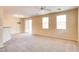 Comfortable living area with carpeted floors and lots of natural light at 9115 Canoga Canyon Ct # 102, Las Vegas, NV 89149