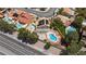 Aerial view of residences with swimming pools and well-maintained landscapes, surrounded by lush greenery at 10021 Skipper Ct, Las Vegas, NV 89117