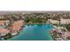 Captivating aerial view of homes lining a serene lake, featuring private boat docks and meticulously maintained landscaping at 10021 Skipper Ct, Las Vegas, NV 89117