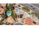 Aerial view of a property showcasing a pool and spa in the backyard and solar panels on the roof at 10021 Skipper Ct, Las Vegas, NV 89117