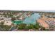 Stunning aerial view of lakeside homes and docks, showcasing peaceful waterfront living with manicured landscaping at 10021 Skipper Ct, Las Vegas, NV 89117