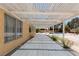 Covered back patio providing shade and views of the pool and backyard, perfect for relaxation and entertaining at 10021 Skipper Ct, Las Vegas, NV 89117