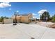 Expansive backyard with a basketball court, shed, covered patio, and a glimpse of the inviting pool area at 10021 Skipper Ct, Las Vegas, NV 89117