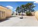 Spacious backyard features a concrete patio with a basketball hoop, offering ample space for recreation at 10021 Skipper Ct, Las Vegas, NV 89117
