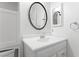 Bathroom features framed mirror and white vanity at 10021 Skipper Ct, Las Vegas, NV 89117