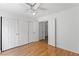 Bedroom features double closets and wood floors at 10021 Skipper Ct, Las Vegas, NV 89117